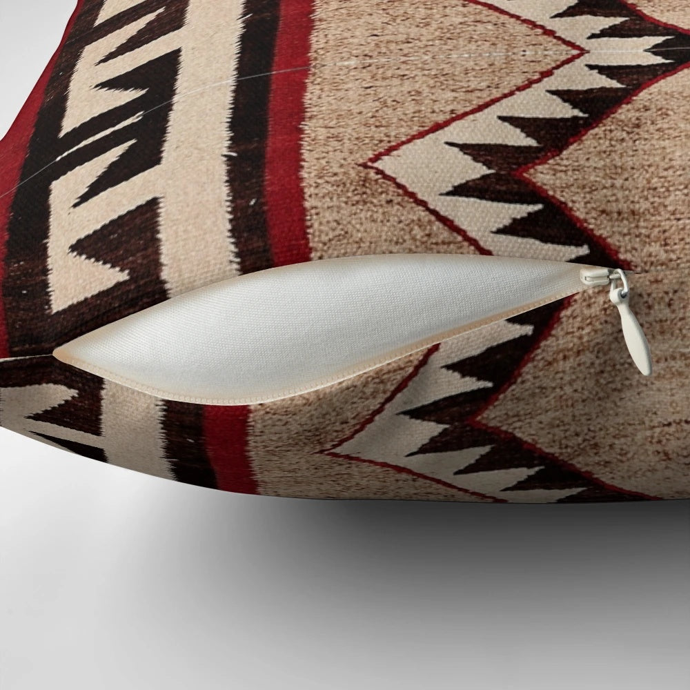 A beautifully-crafted pillow featuring a vibrant Navajo-inspired pattern, perfect for adding a touch of tribal style to any space.
