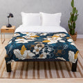 Navy and gold floral plush blanket with seamless peony and blossom pattern