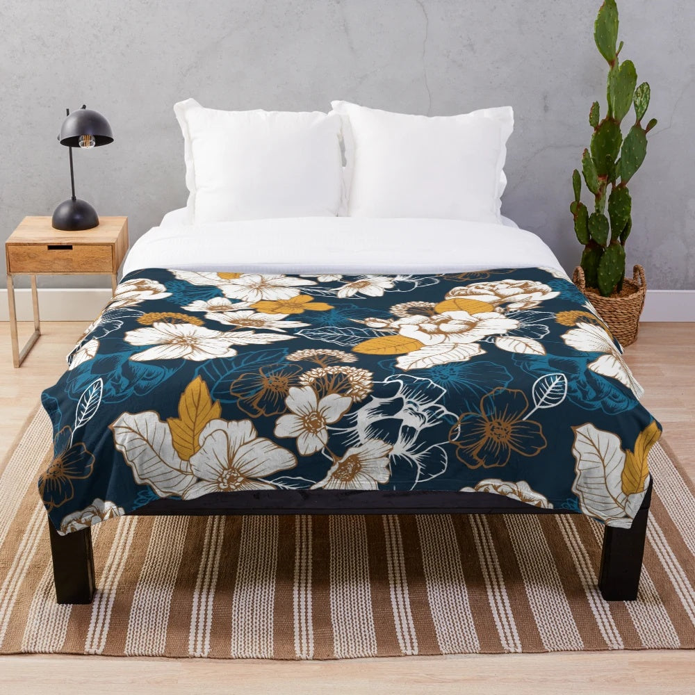 Navy and gold floral plush blanket with seamless peony and blossom pattern