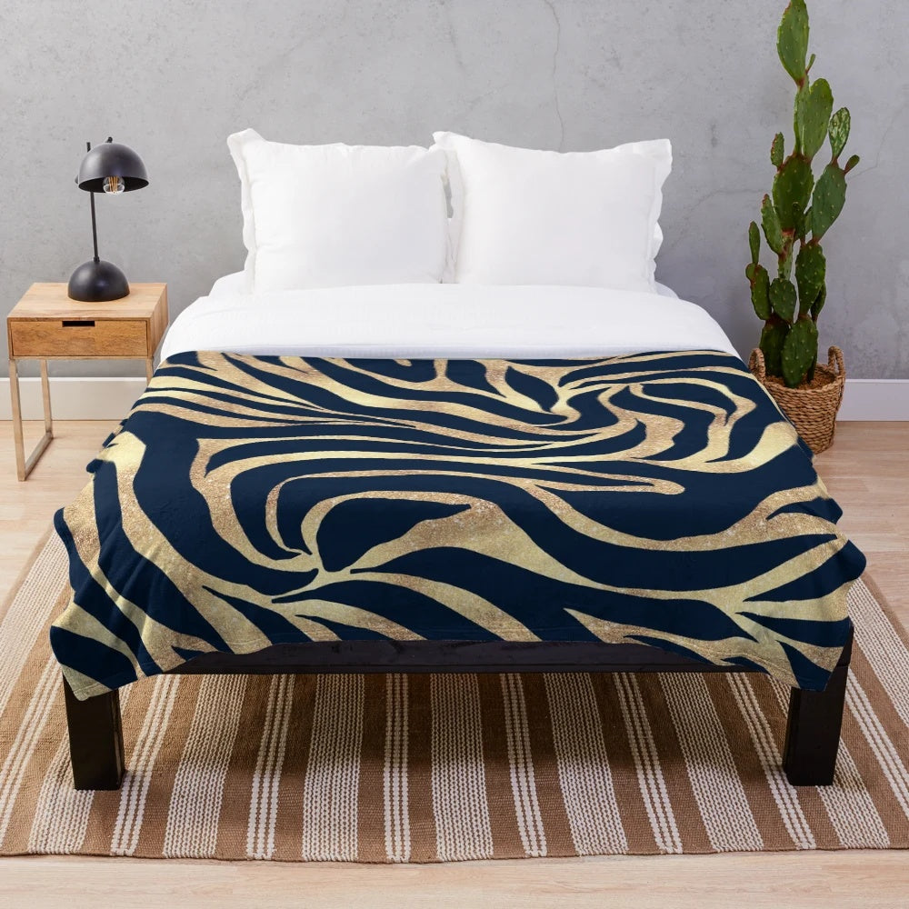 Navy blue and gold zebra print plush blanket