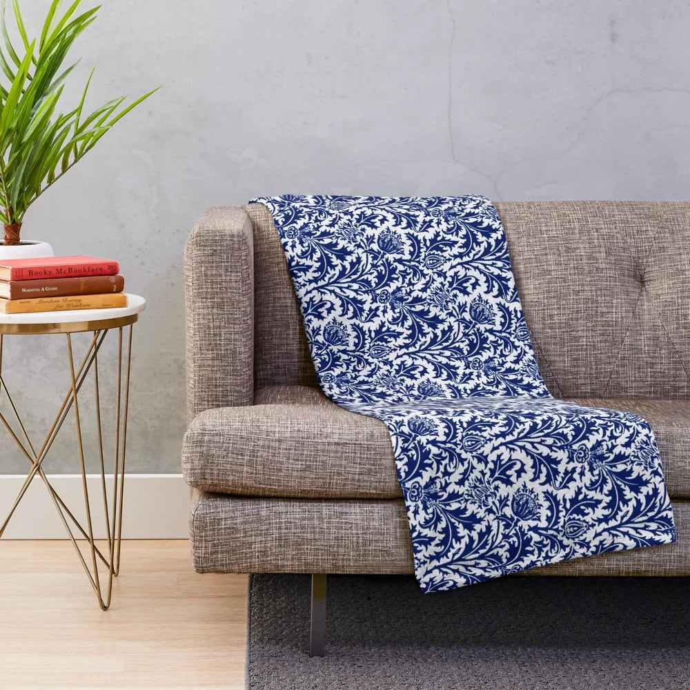 Vintage-inspired navy blue and white plush blanket featuring a damask thistle floral design in the William Morris art nouveau style.
