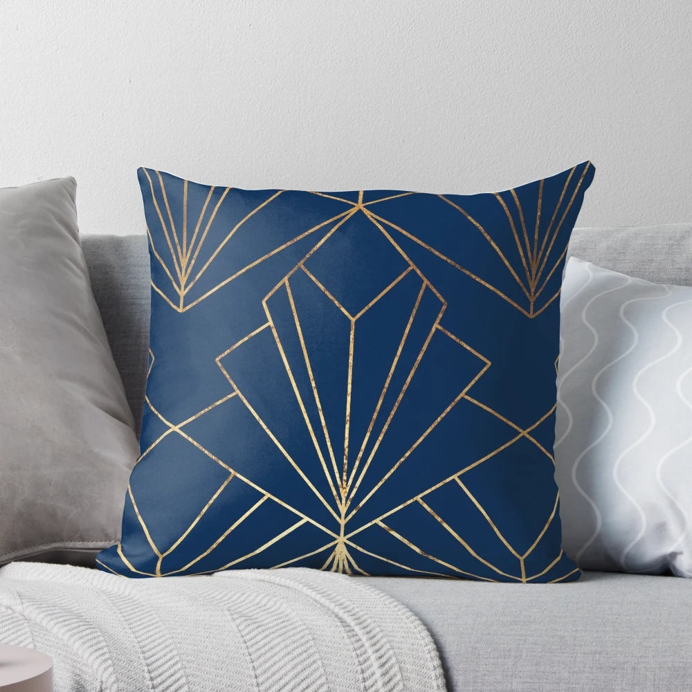 Navy blue art deco inspired pillow with a modern geometric line art design in gold foil