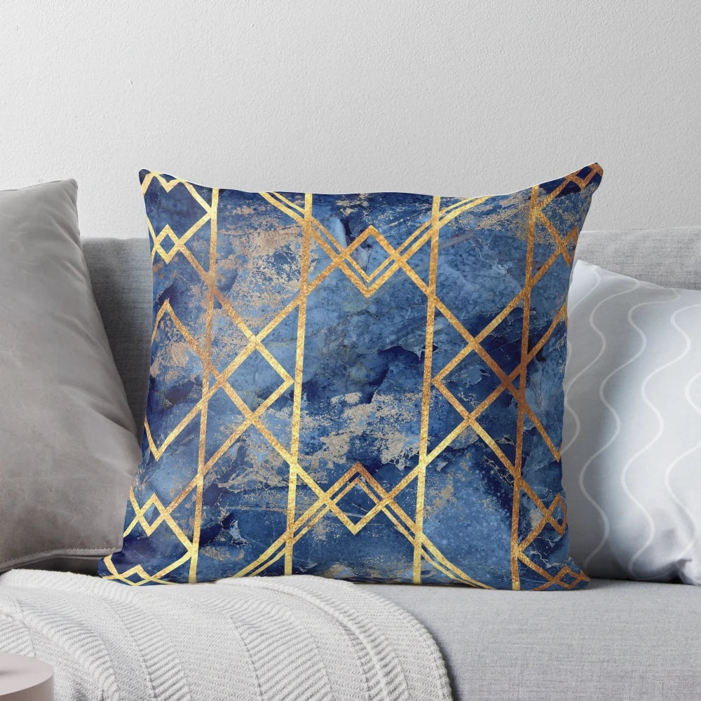 Navy and gold geometric stone patterned throw pillow with a modern, abstract design