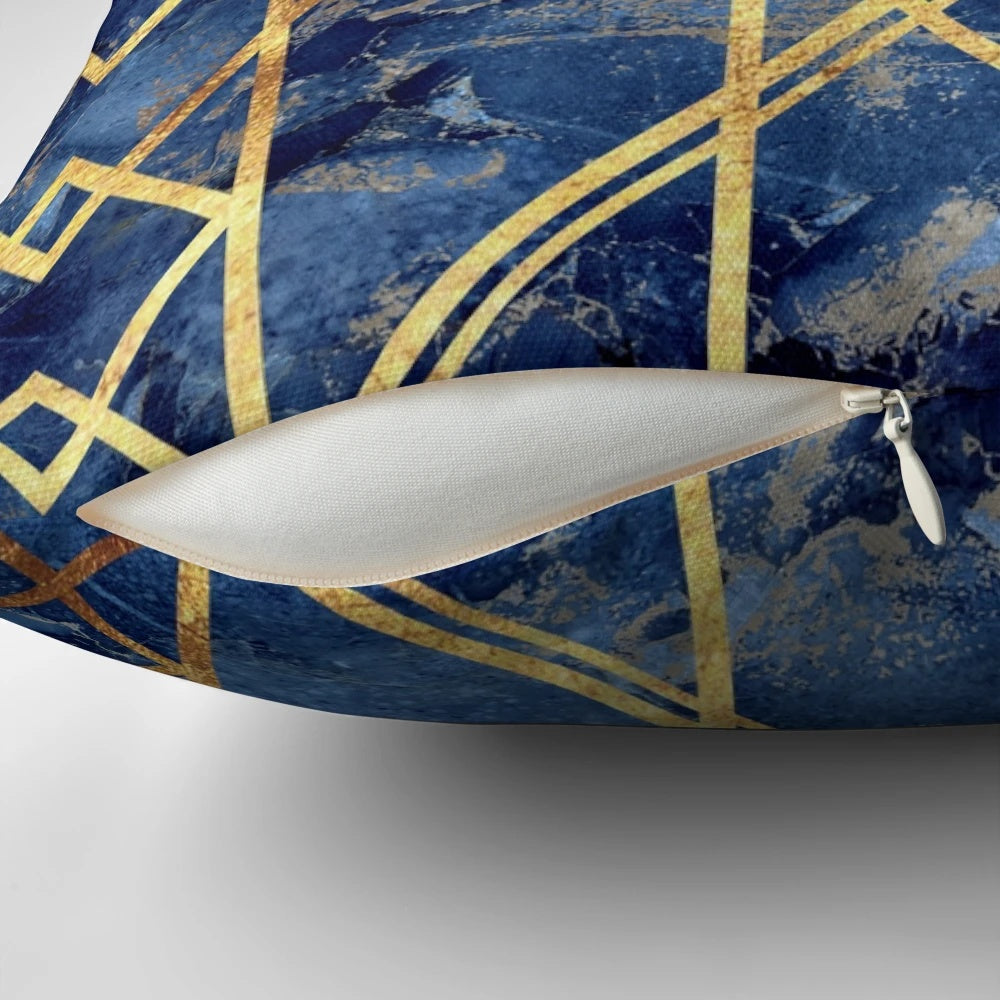 Navy and gold geometric stone patterned throw pillow with a modern, abstract design
