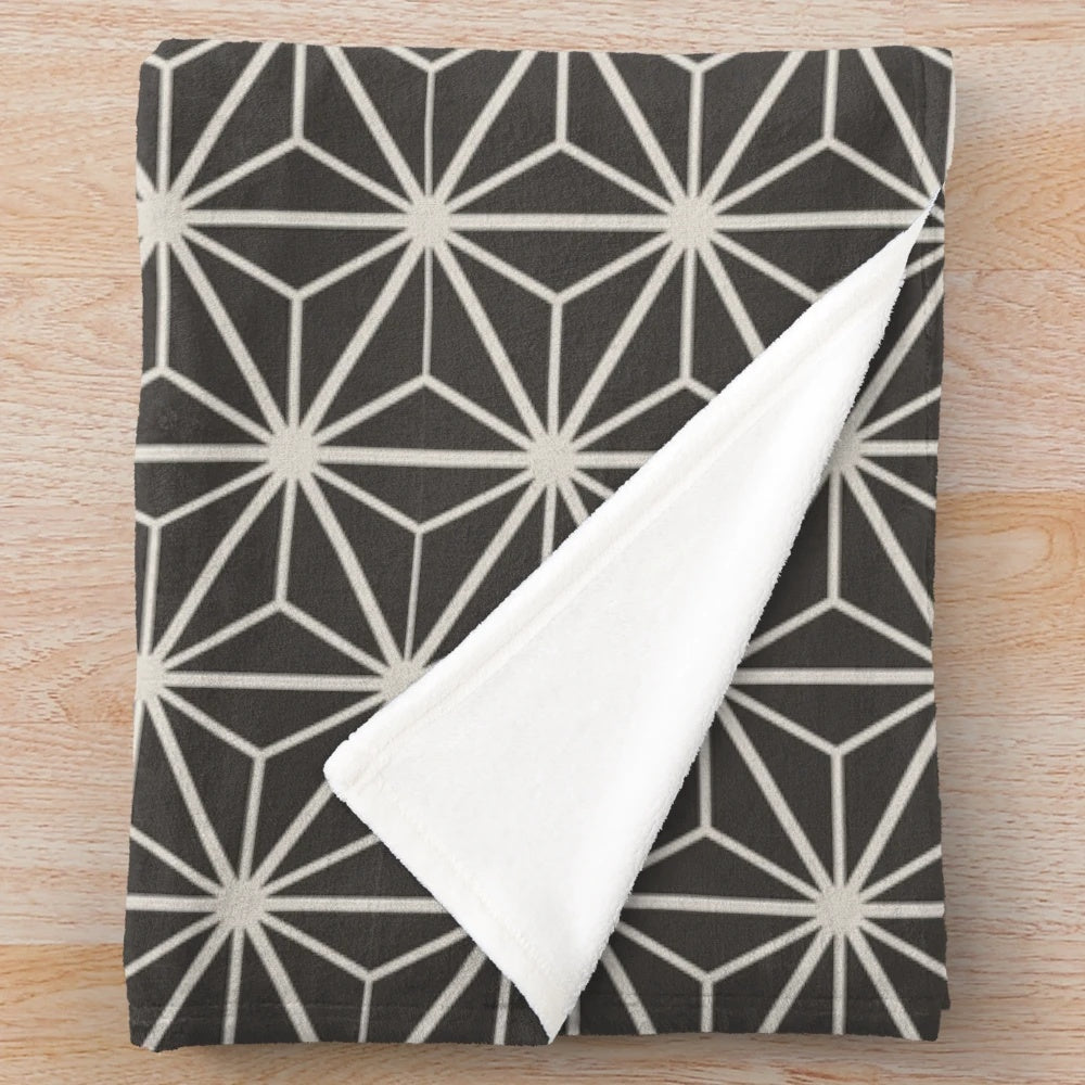 Japanese inspired neutral grey plush blanket with intricate geometric floral design