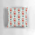 A vibrant red and green pillow featuring the iconic Nutcracker ballet design by artist Andrea Lauren.