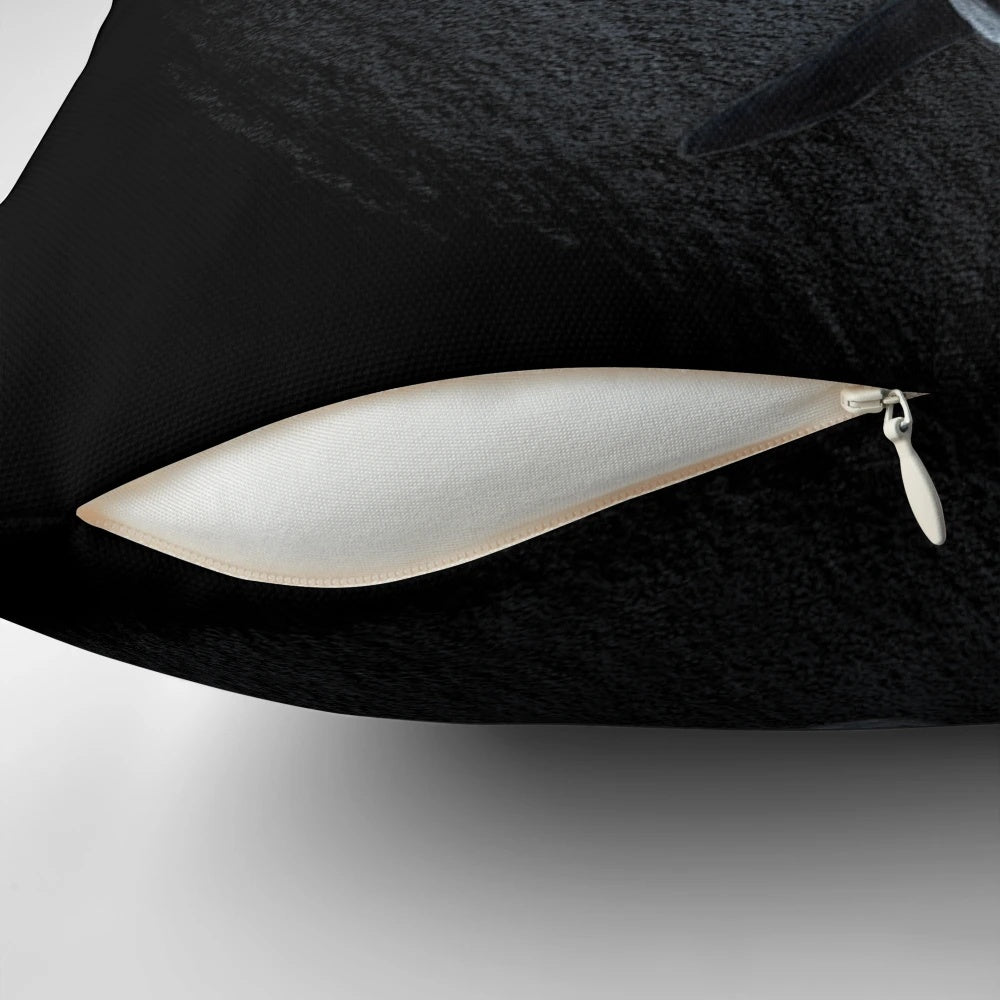 Soft, plush orca-shaped pillow in a monochrome black and white color scheme