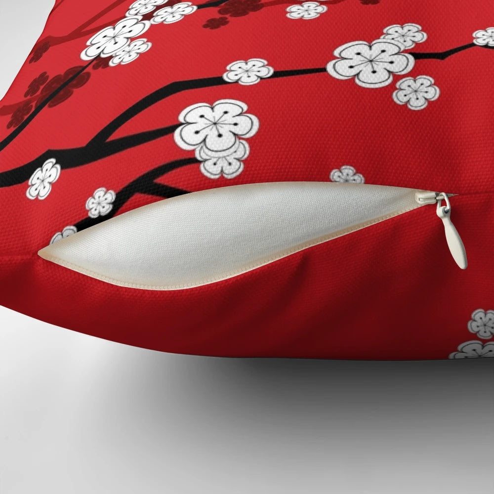 Decorative pillow showcasing vibrant Japanese Sakura cherry blossoms against a red background