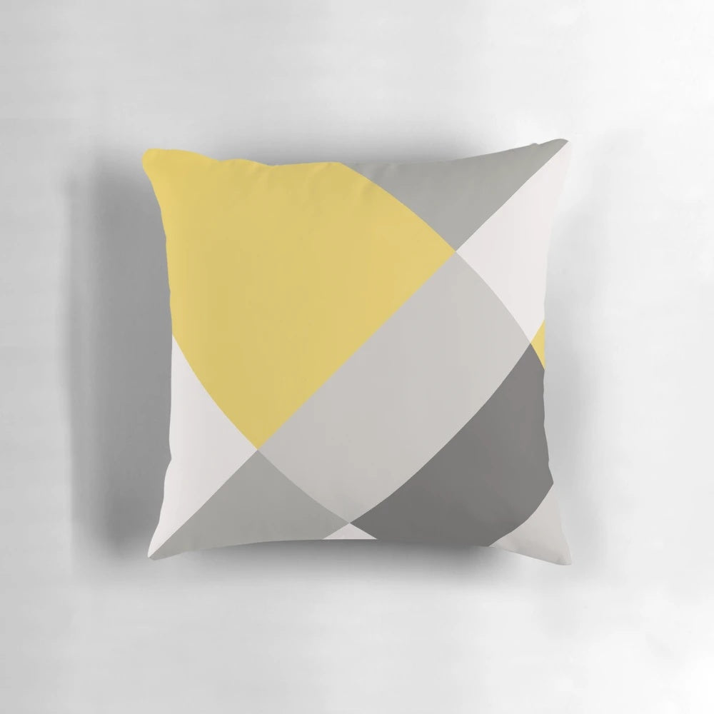 Mustard yellow and grey patchwork square pillow with minimalist, geometric design