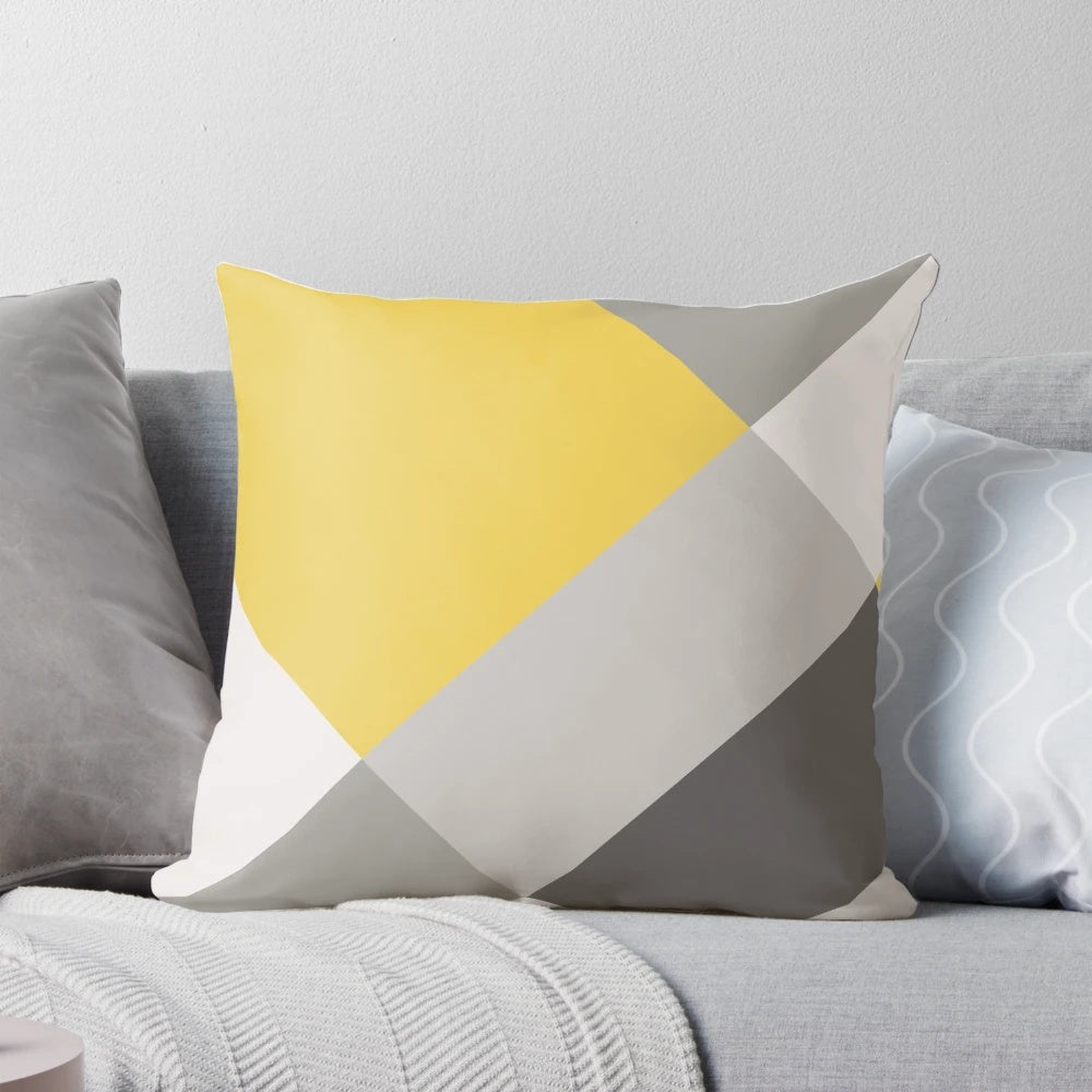 Mustard yellow and grey patchwork square pillow with minimalist, geometric design