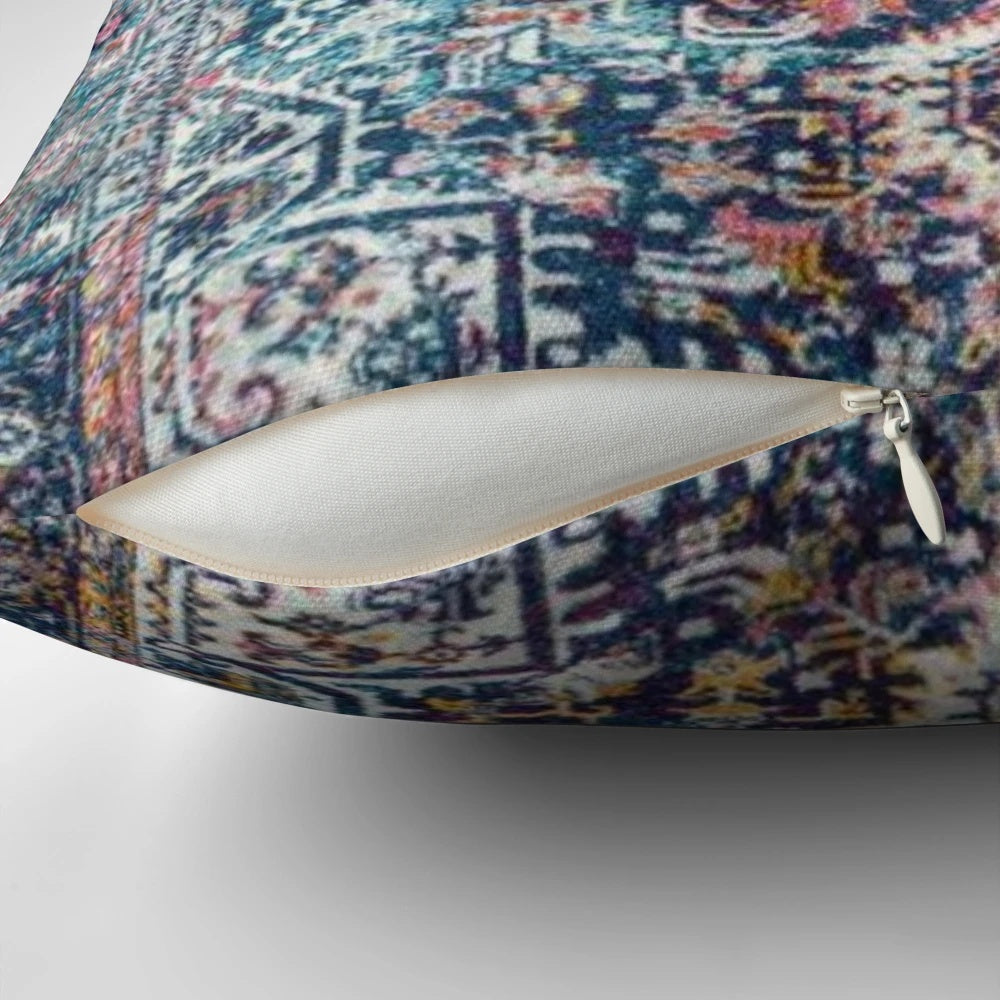 Persian antique carpet pattern pillow with blue, gold, and ochre colors.