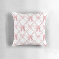 Soft, pink decorative pillow with delicate bows for a chic, ballerina-inspired style