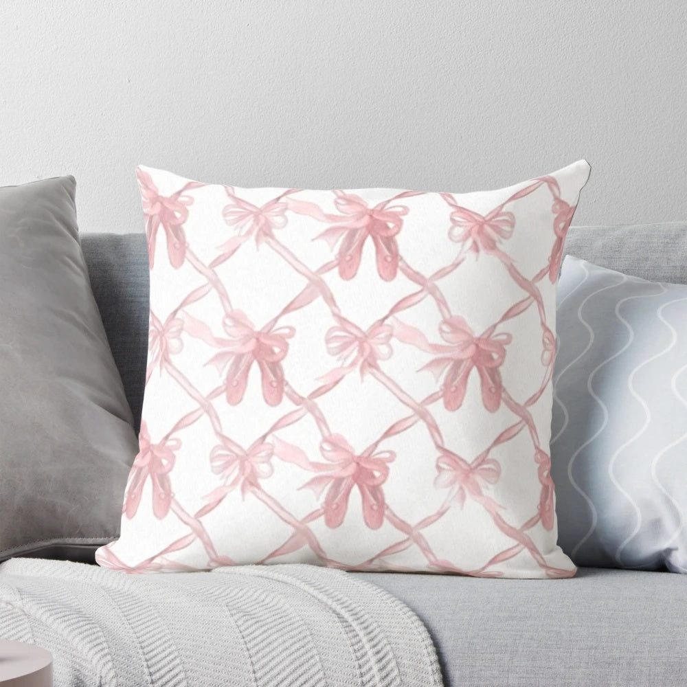 Soft, pink decorative pillow with delicate bows for a chic, ballerina-inspired style
