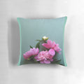 A close-up photograph of vibrant pink peony flowers blooming against a lush green background, perfect for nature-inspired home decor.