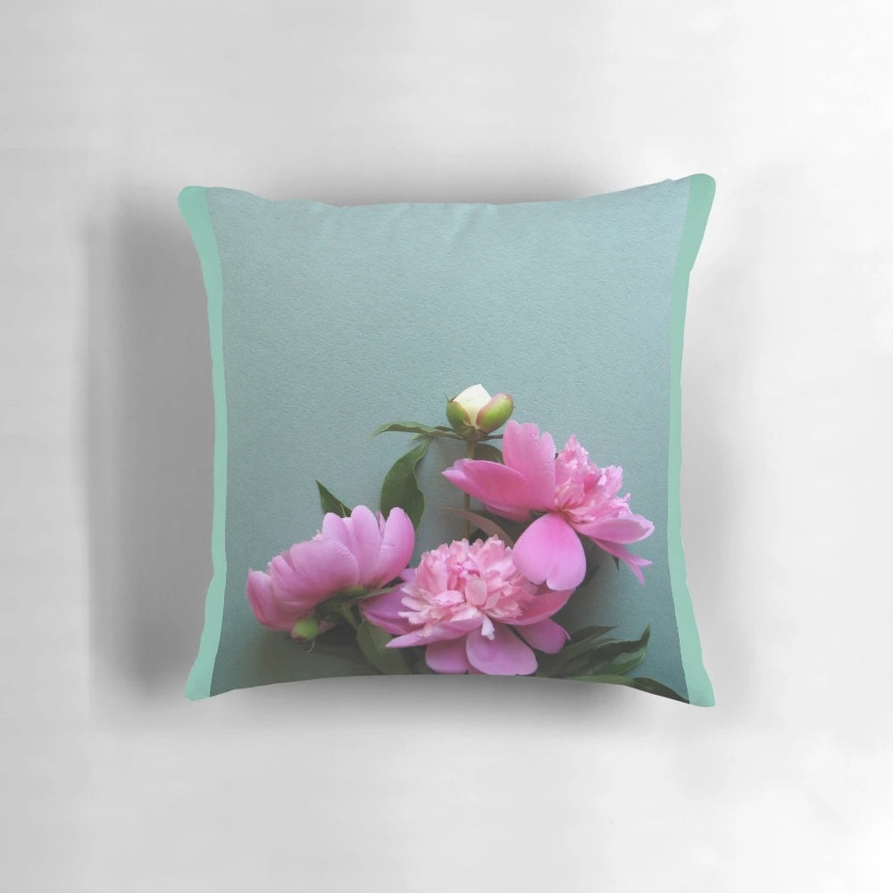 A close-up photograph of vibrant pink peony flowers blooming against a lush green background, perfect for nature-inspired home decor.