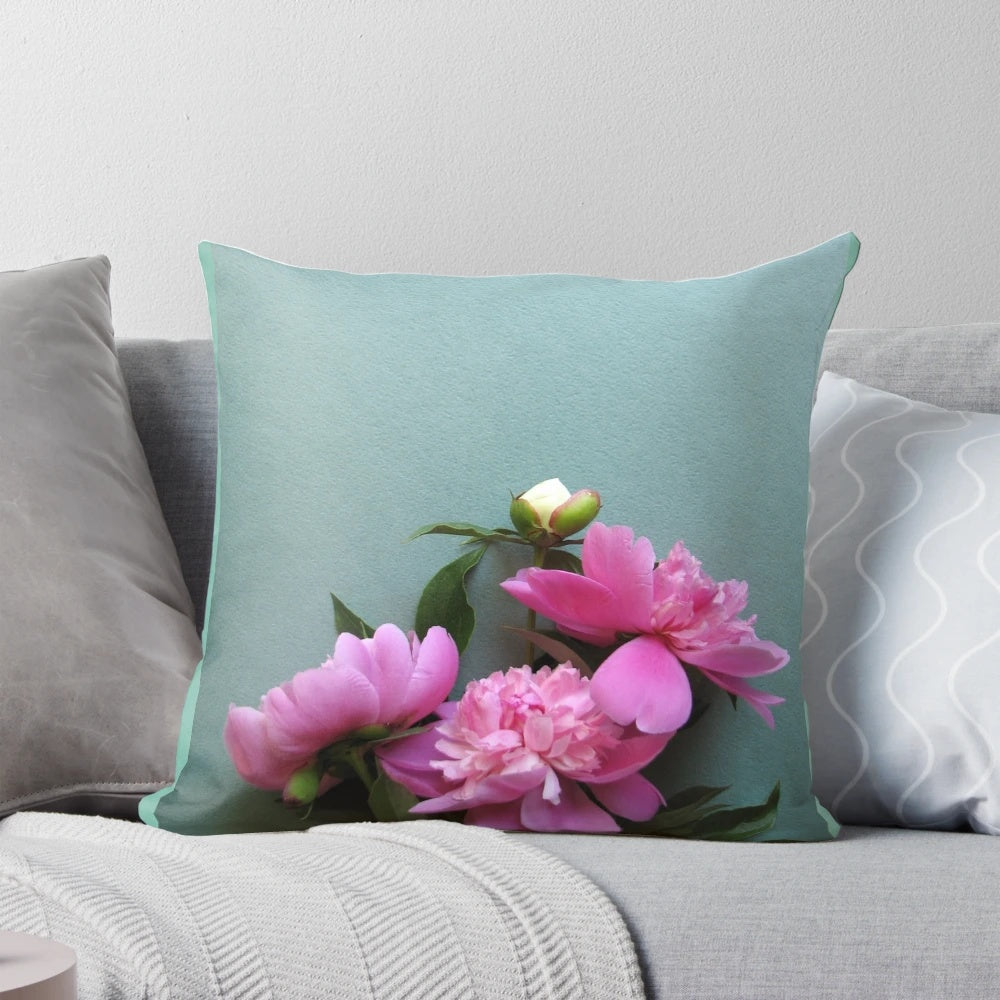 A close-up photograph of vibrant pink peony flowers blooming against a lush green background, perfect for nature-inspired home decor.