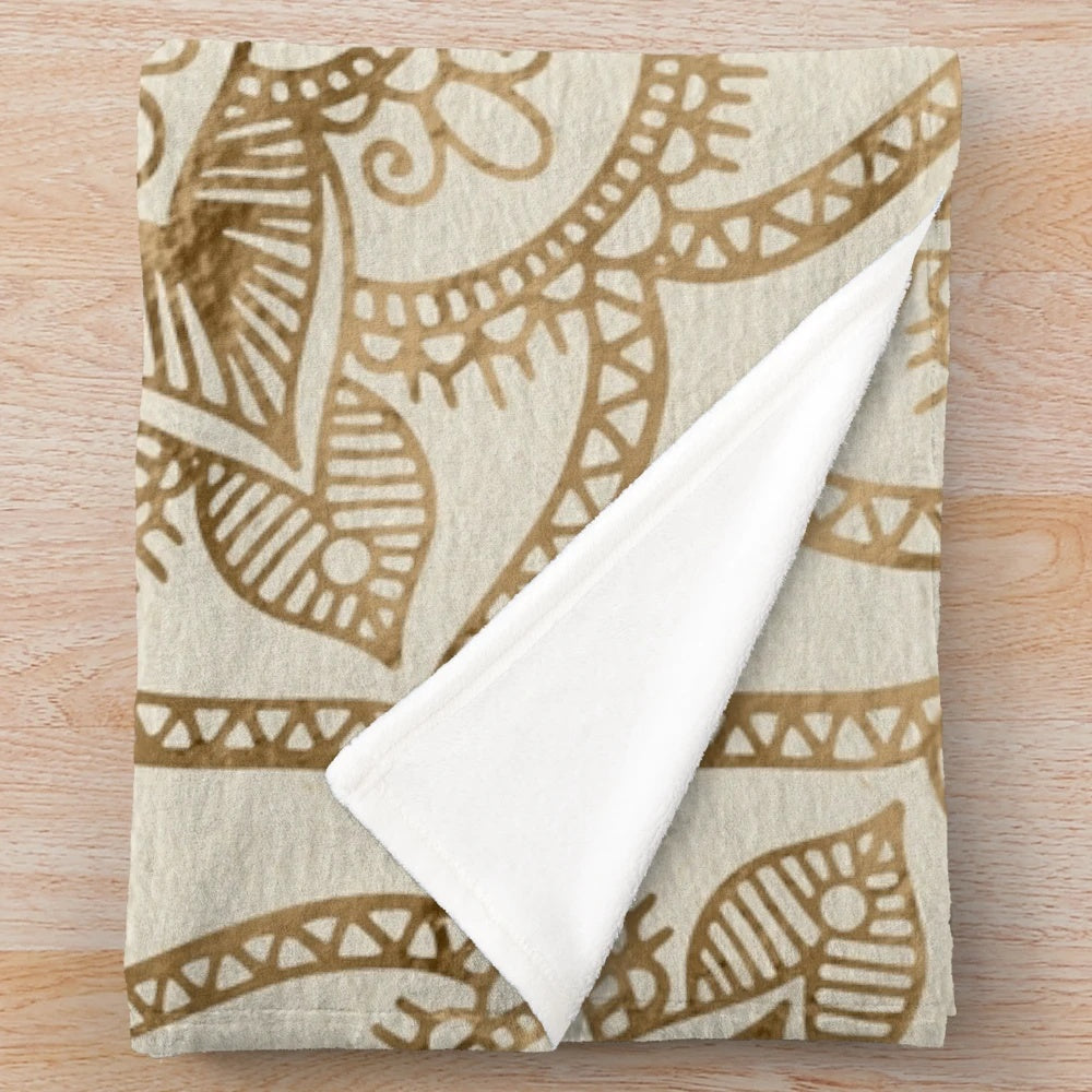 Plush blanket featuring a Flower of Life design in pastel gold and canvas colors