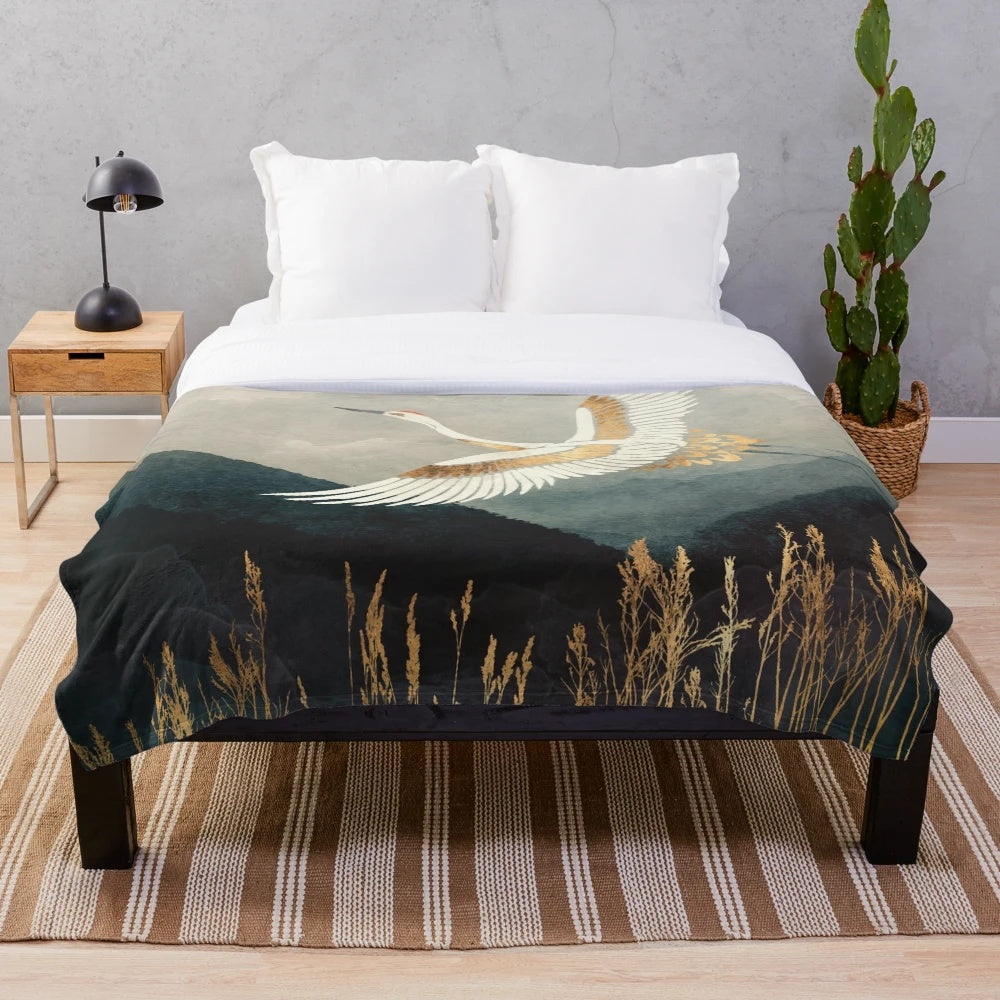 Elegant plush blanket with a nature landscape design featuring a crane bird in flight