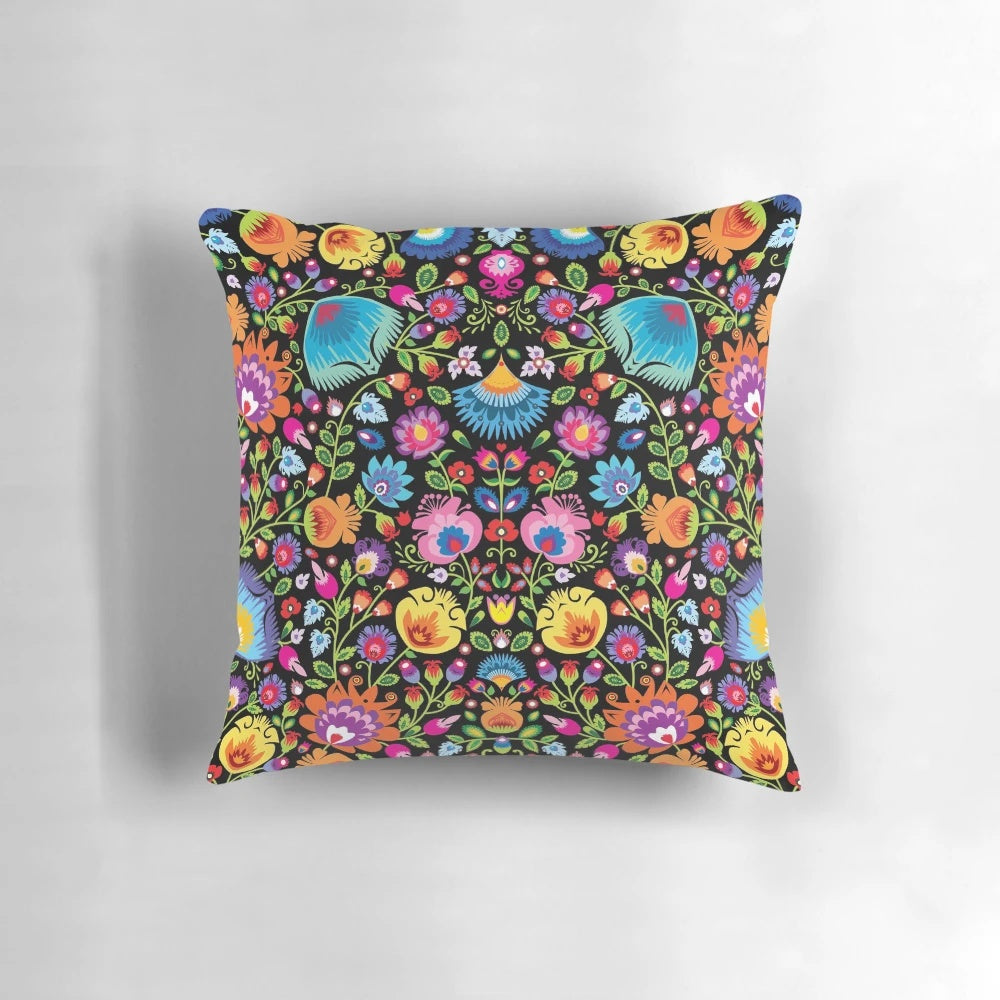 Colorful folk art floral design Wycinanki pillow on black background