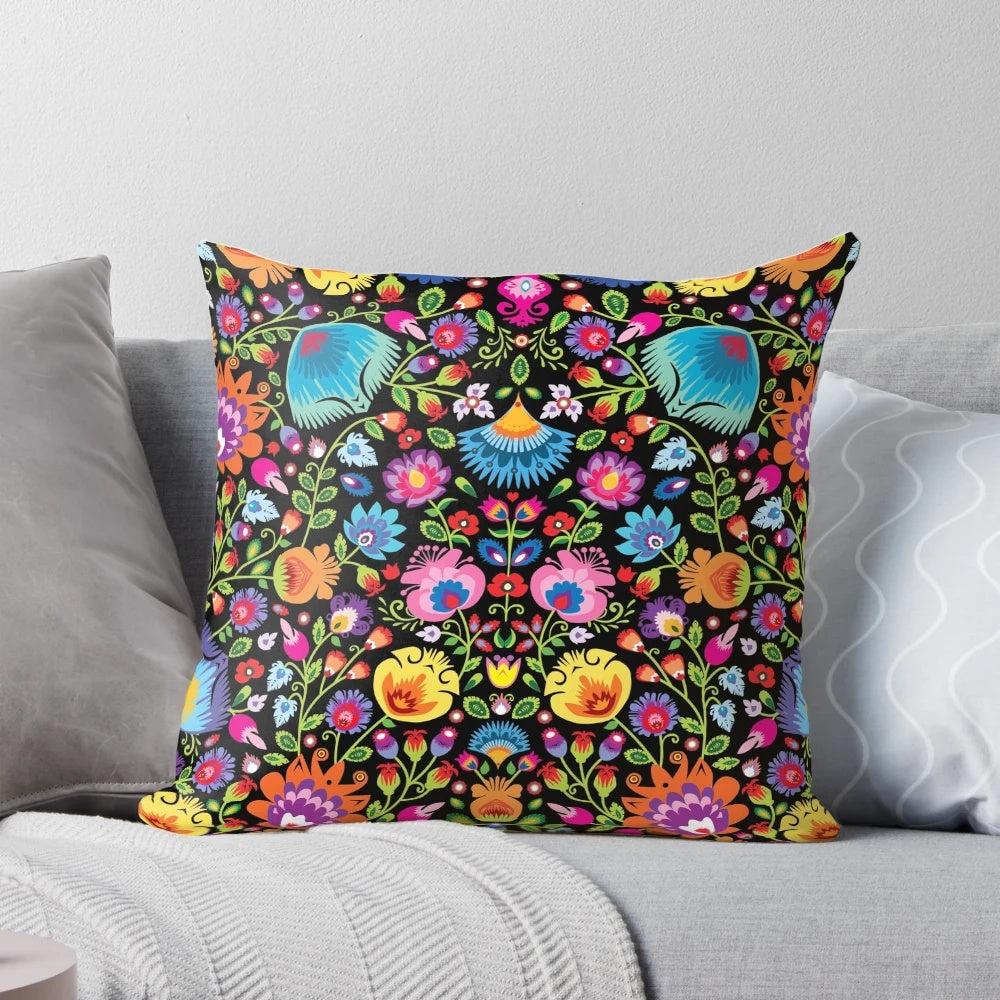 Colorful folk art floral design Wycinanki pillow on black background