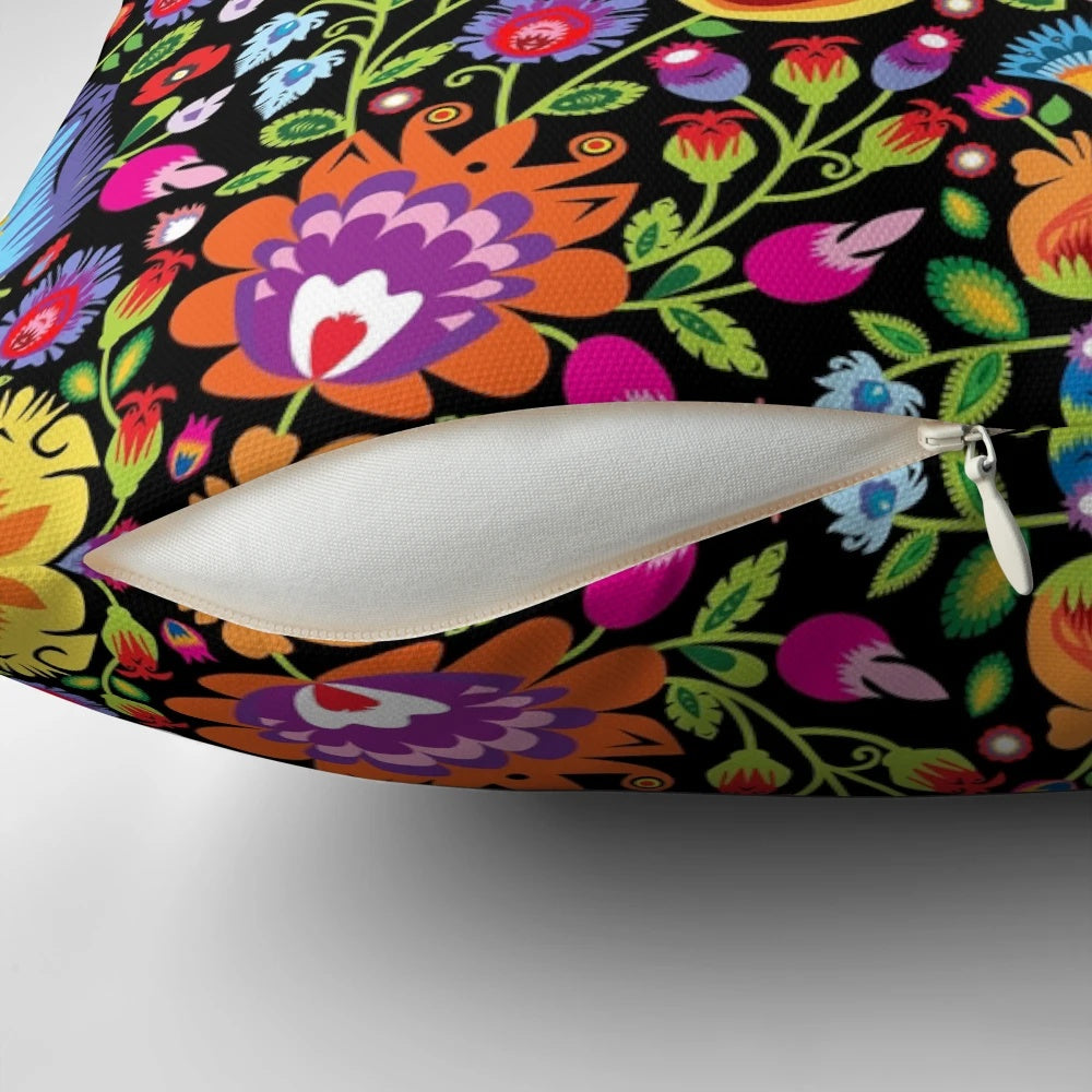 Colorful folk art floral design Wycinanki pillow on black background