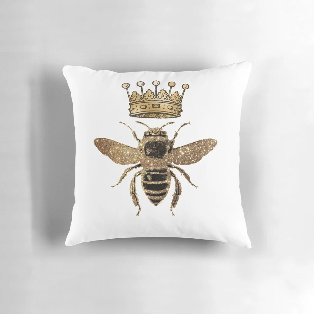 Decorative black and gold throw pillow with queen bee design