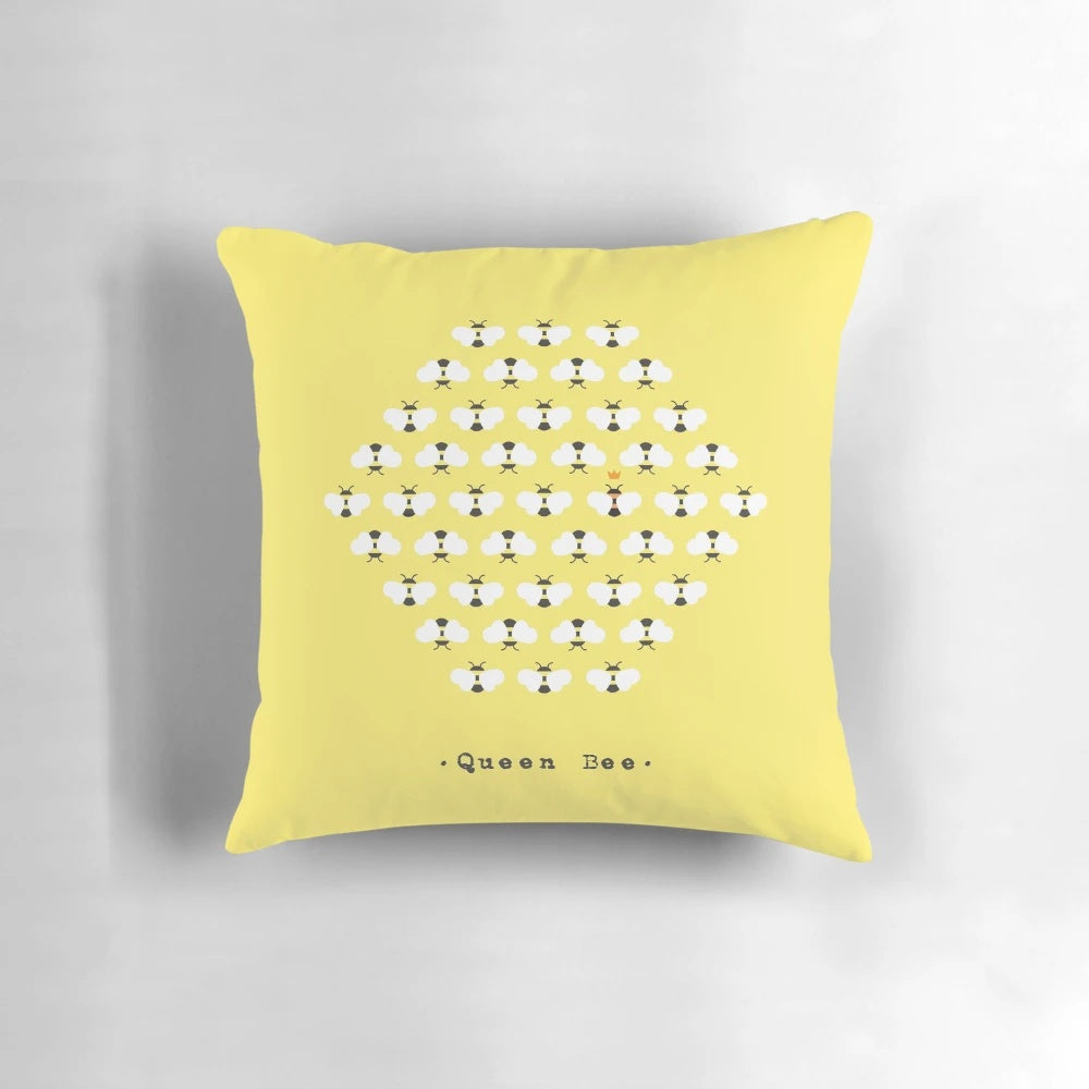 Soft, decorative queen bee pillow with yellow and black patterns, perfect for natural, bee-inspired home accents.
