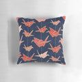 Vibrant red origami crane design on a navy blue pillow, creating a stunning Japanese-inspired accent piece.