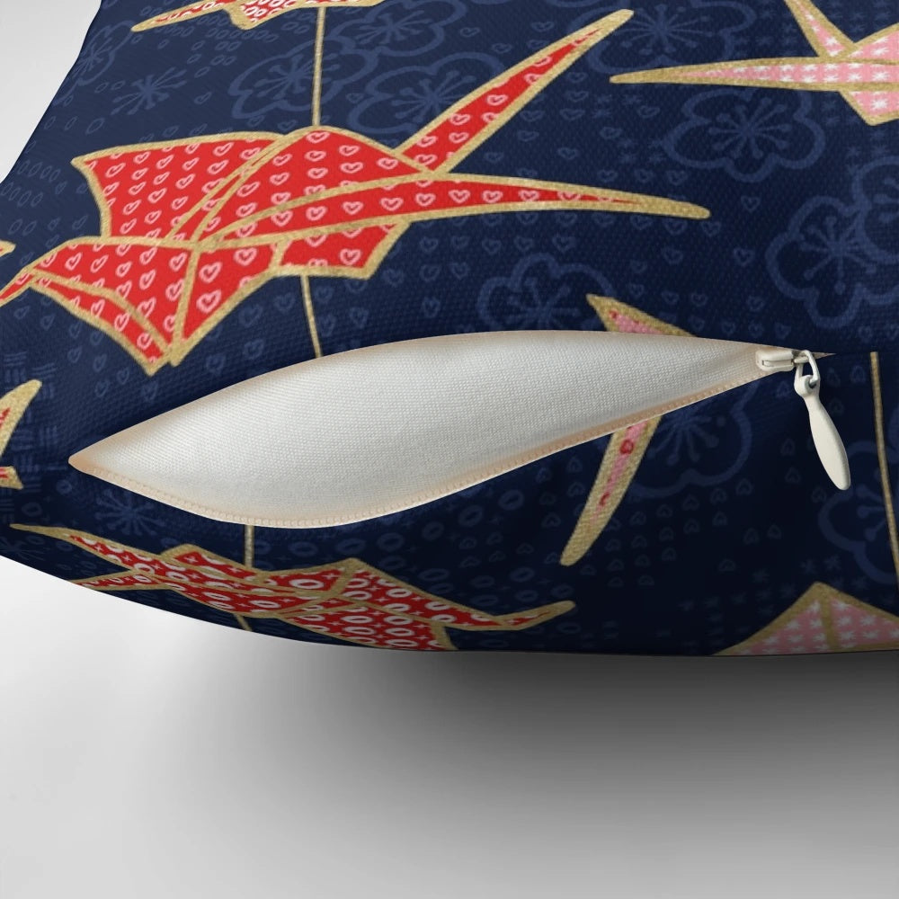 Vibrant red origami crane design on a navy blue pillow, creating a stunning Japanese-inspired accent piece.