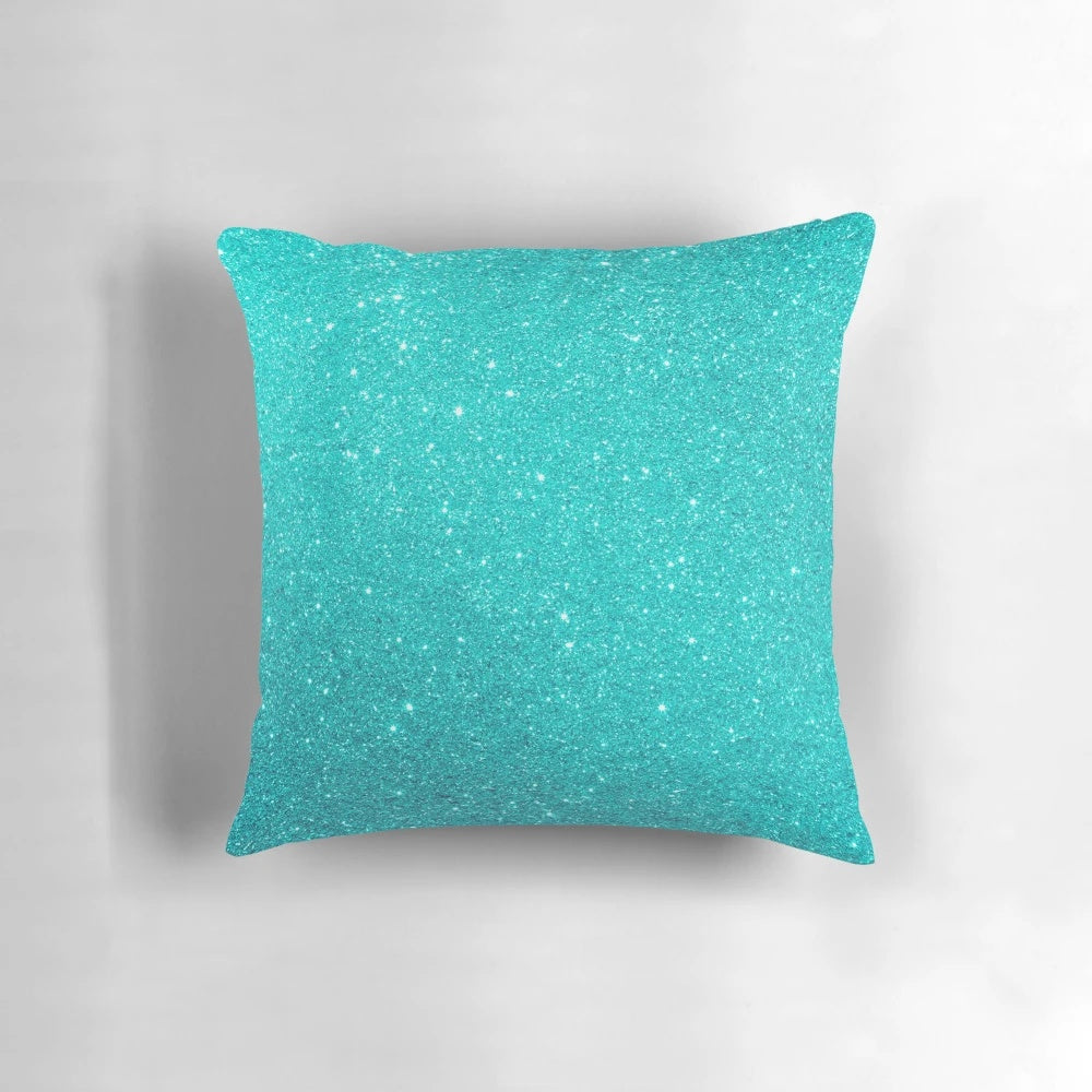 A beautiful pillow featuring a gradient of robin's egg blue hues with a shimmering silver glitter accent.