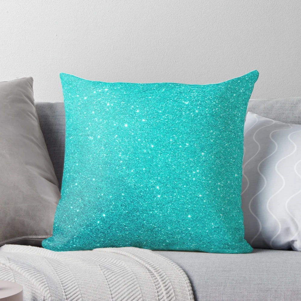 A beautiful pillow featuring a gradient of robin's egg blue hues with a shimmering silver glitter accent.