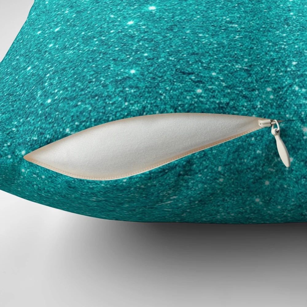 A beautiful pillow featuring a gradient of robin's egg blue hues with a shimmering silver glitter accent.