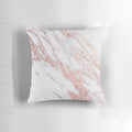 Rose gold marble pillow with a natural, glittering design