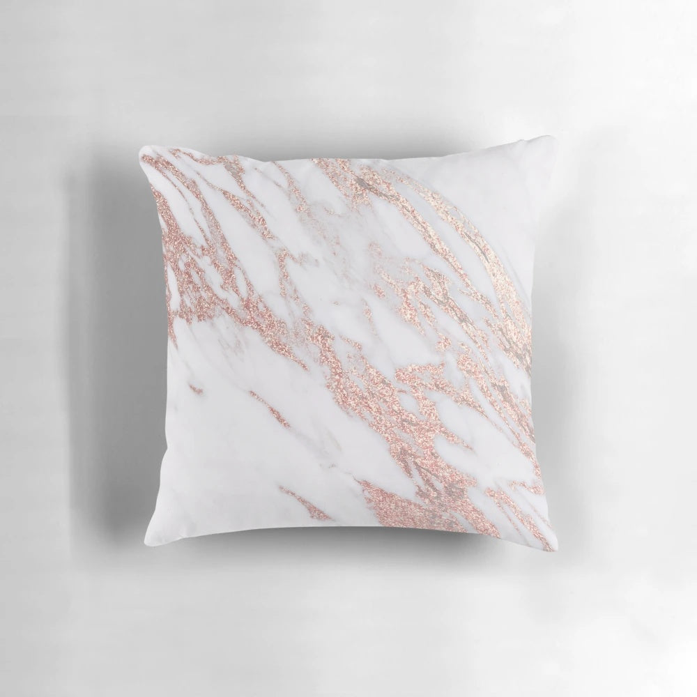 Rose gold marble pillow with a natural, glittering design