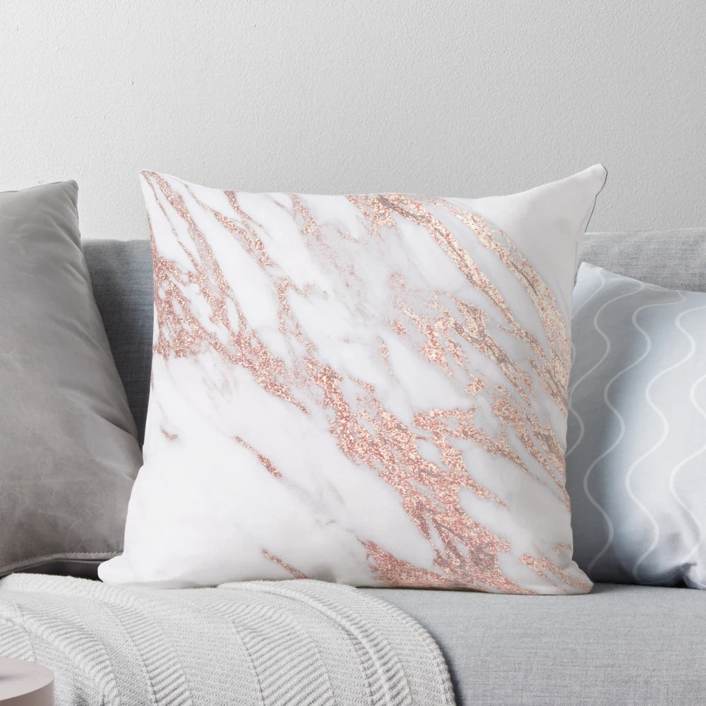 Rose gold marble pillow with a natural, glittering design
