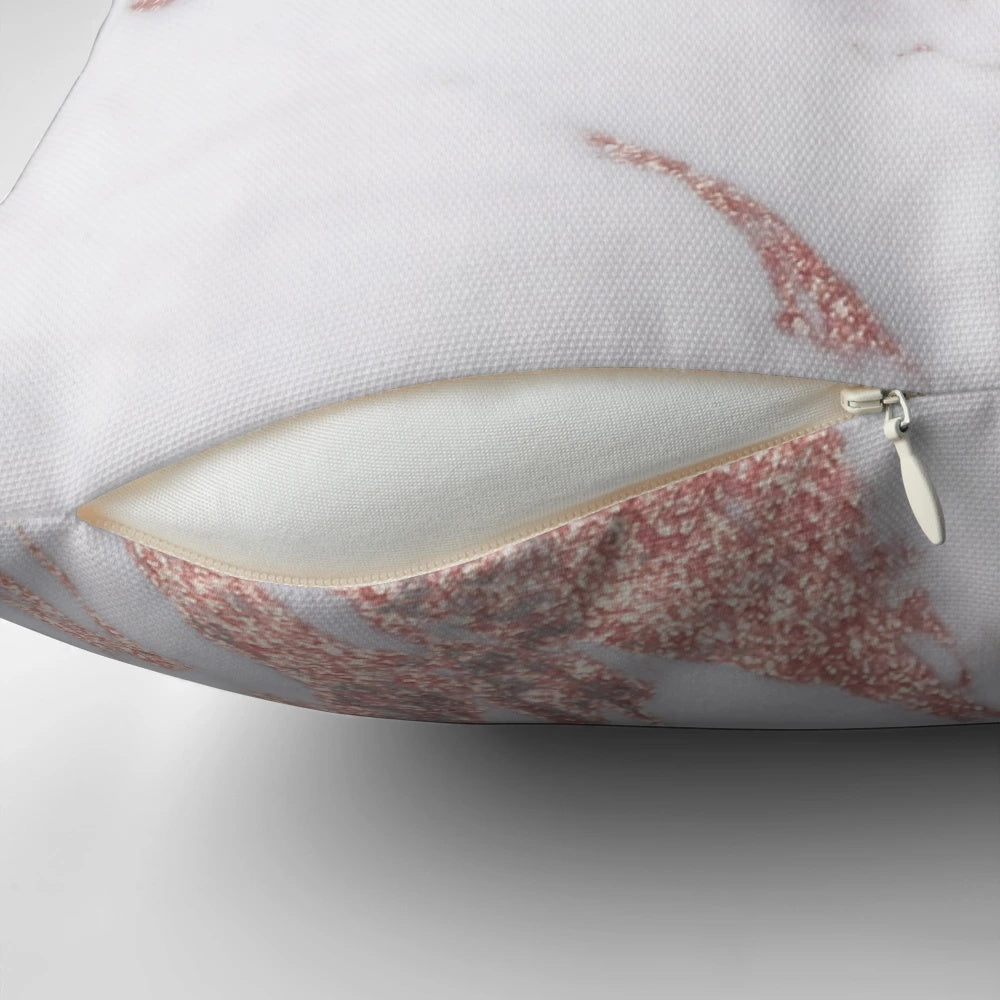 Rose gold marble pillow with a natural, glittering design