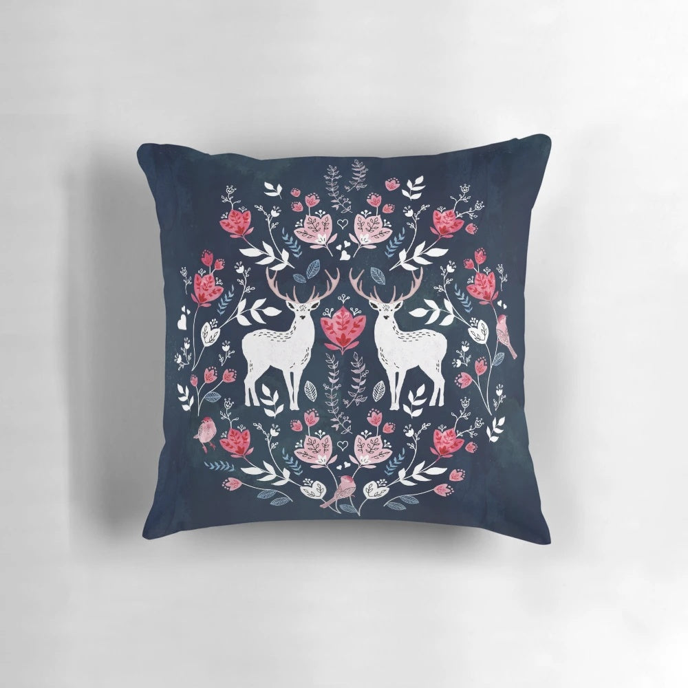 A navy blue decorative pillow featuring a beautiful Scandinavian-inspired watercolor floral pattern.
