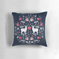 A navy blue decorative pillow featuring a beautiful Scandinavian-inspired watercolor floral pattern.