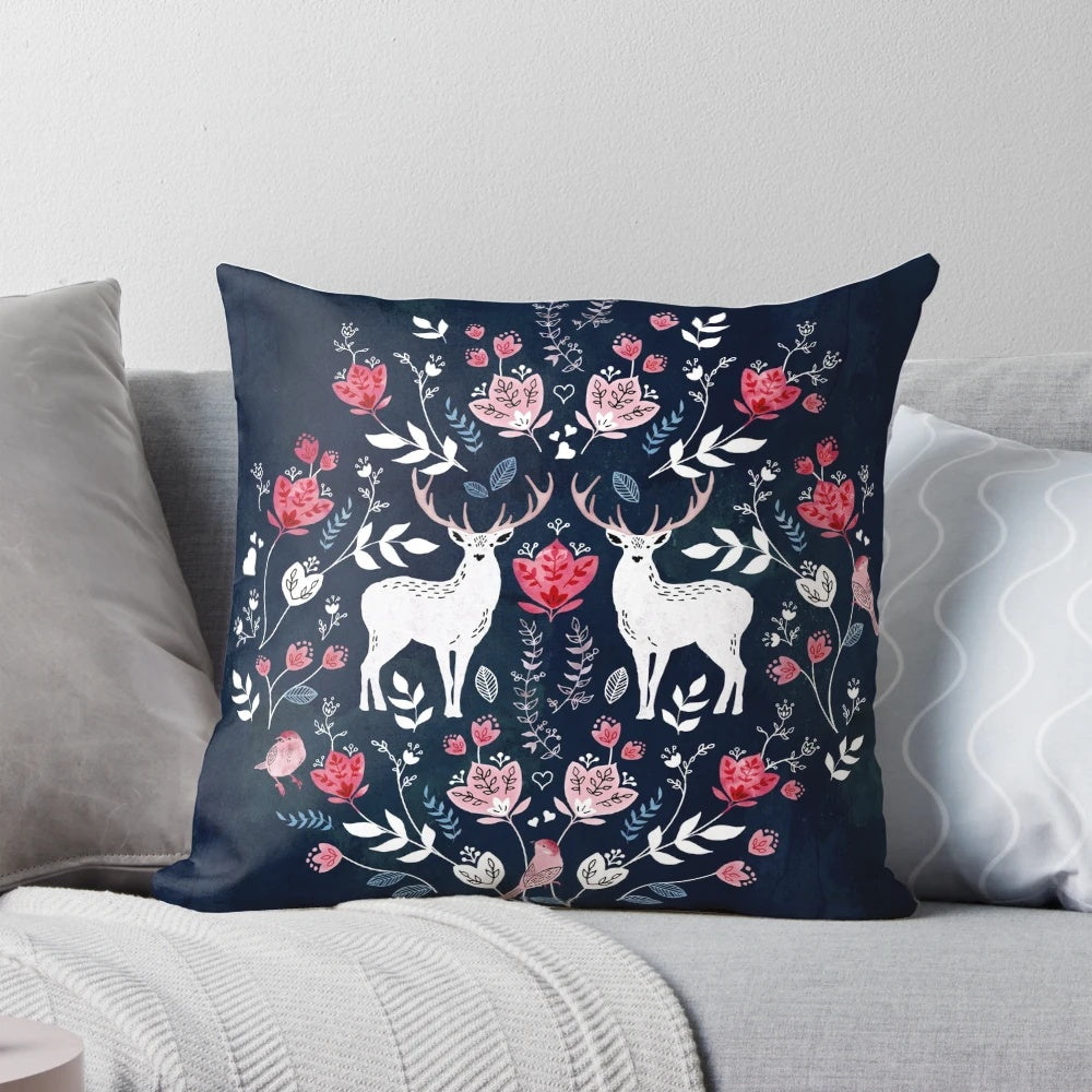 A navy blue decorative pillow featuring a beautiful Scandinavian-inspired watercolor floral pattern.