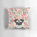 A beautiful floral-patterned throw pillow featuring the portrait of a Schnauzer dog.