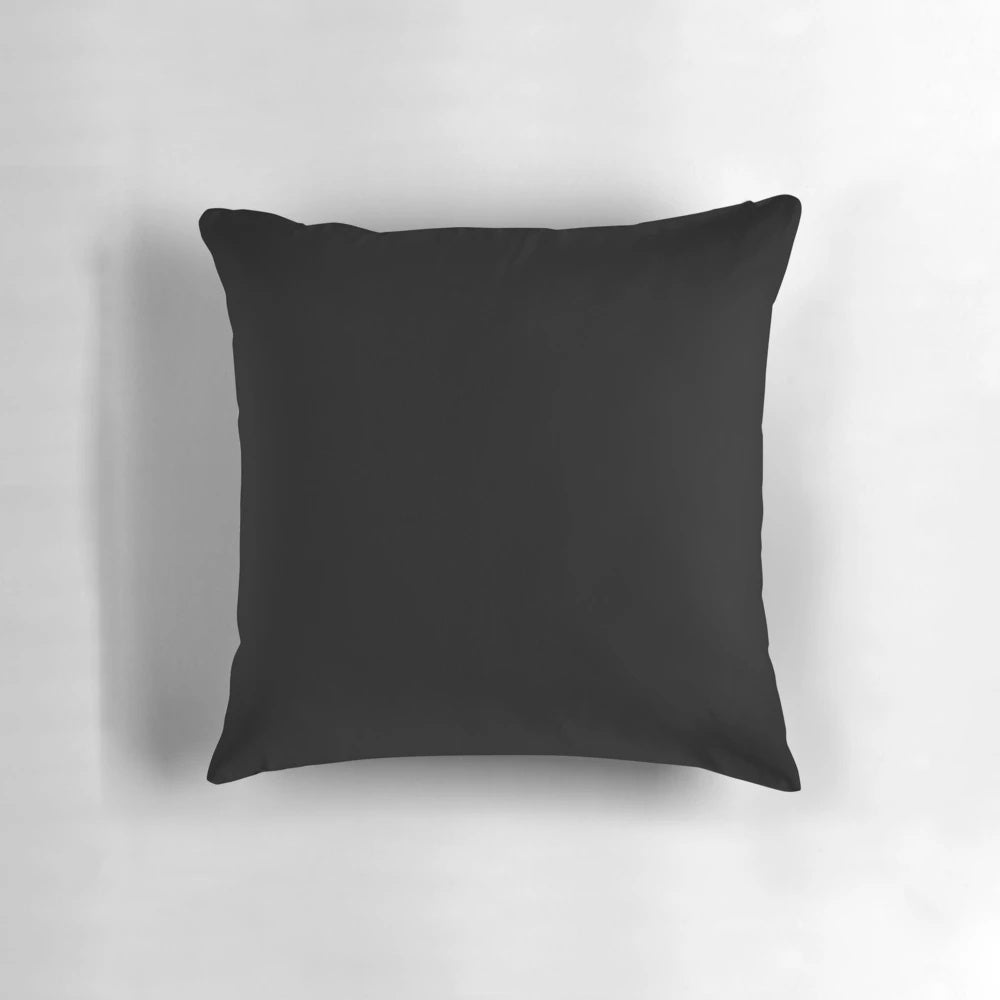 Solid black duvet cover, cushions, and other bedroom accessories