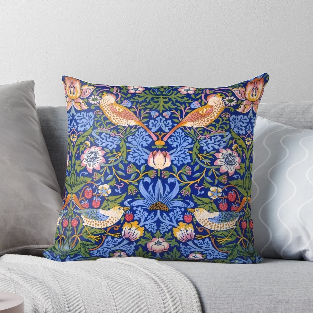 Decorative throw pillow featuring the iconic "Strawberry Thief" design by renowned Victorian artist William Morris
