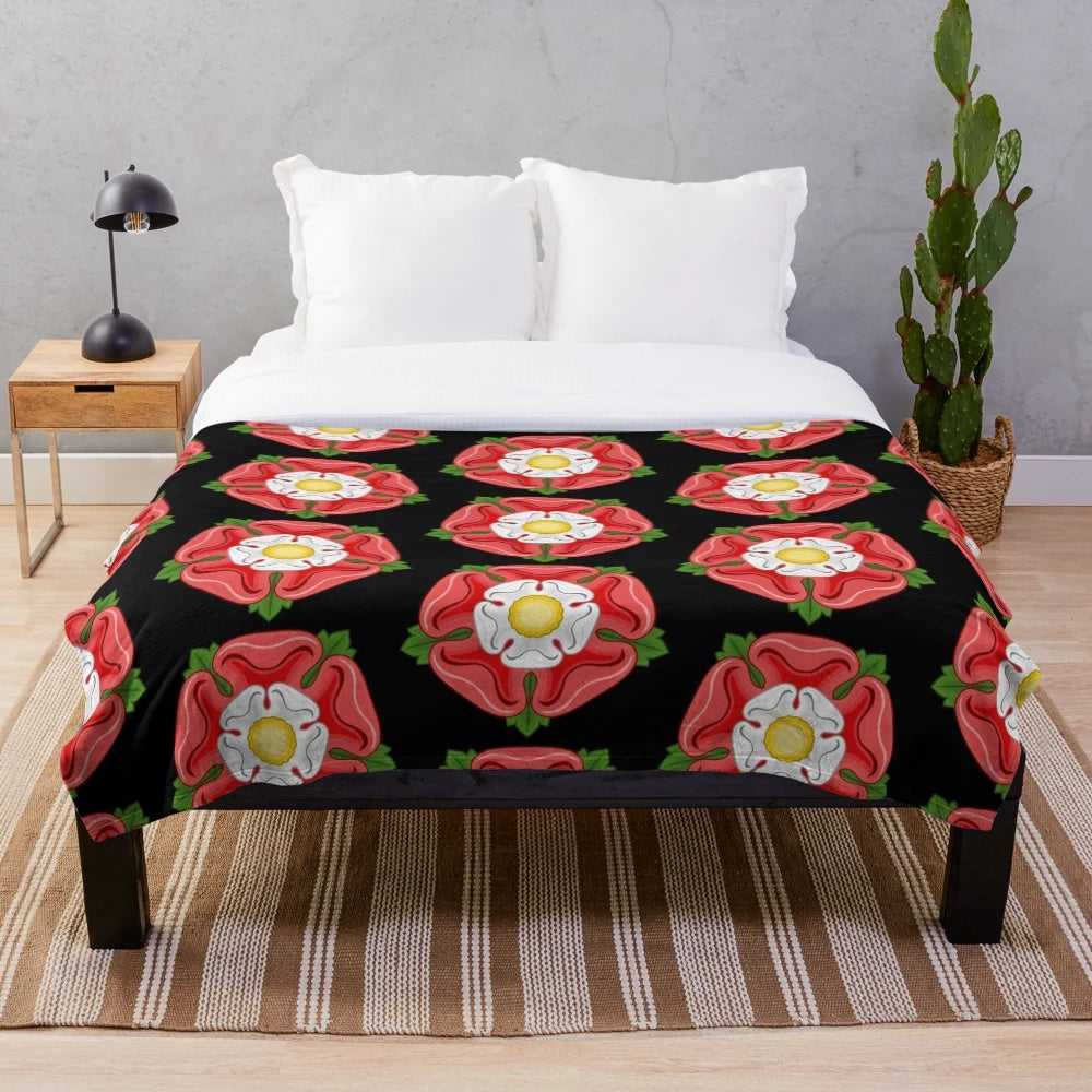 Luxurious plush blanket featuring a Tudor rose design, a symbol of the Tudor royal dynasty