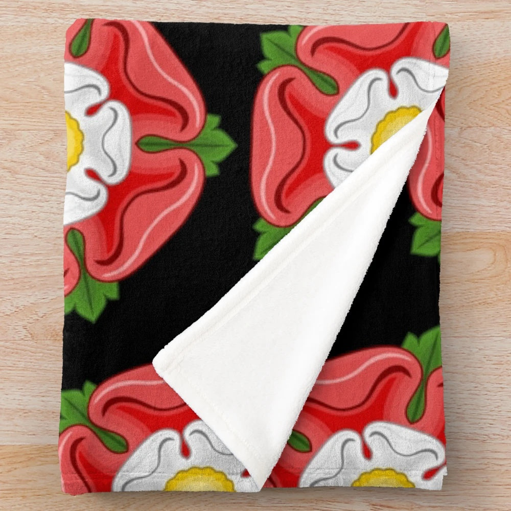 Luxurious plush blanket featuring a Tudor rose design, a symbol of the Tudor royal dynasty