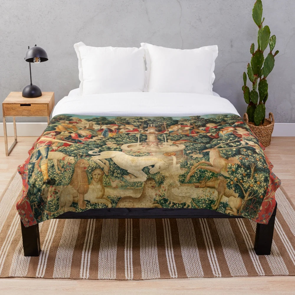 Soft, plush blanket featuring a unicorn design in a floral, nature-inspired pattern