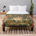 Soft, plush blanket featuring a unicorn design in a floral, nature-inspired pattern