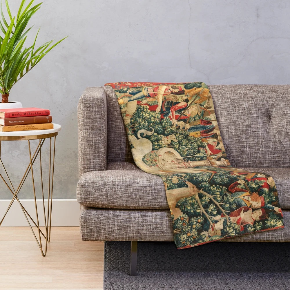 Soft, plush blanket featuring a unicorn design in a floral, nature-inspired pattern