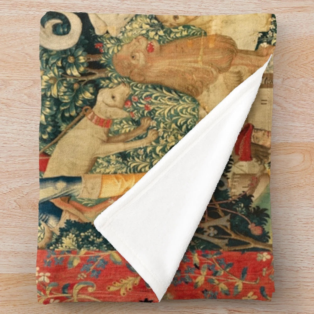 Soft, plush blanket featuring a unicorn design in a floral, nature-inspired pattern