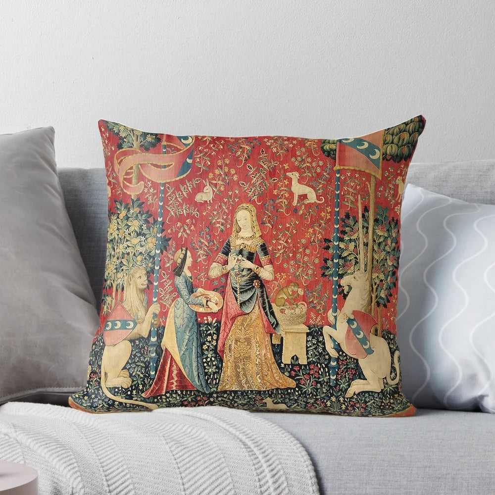 A beautiful black floral throw pillow featuring a mythological unicorn in a medieval garden setting.