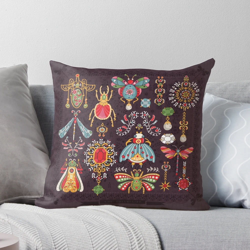 Vibrant, Victorian-styled pillow featuring intricate bug and jewelry designs